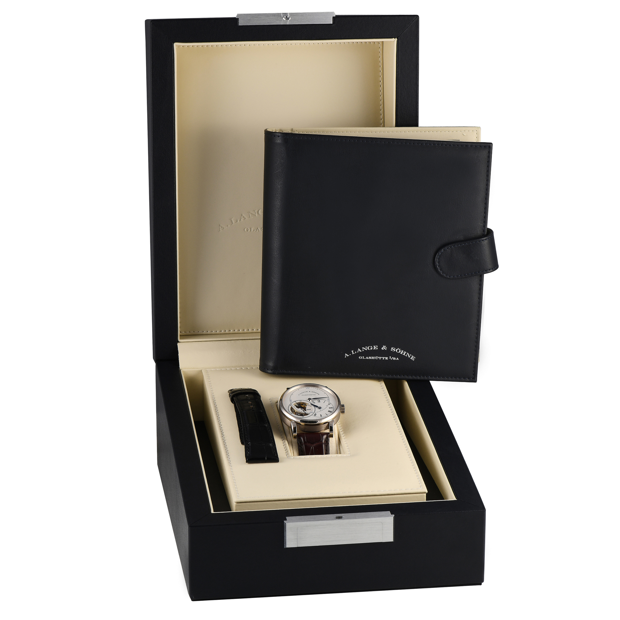 Finished to standard Lange perfection, the Richard Lange Tourbillon "Pour le Mérite" is unquestionably a breathtaking watch. It boasts a one-minute tourbillon and fusée-and-chain transmission that enables the watch to keep running at an exact rate. The technically impressive mechanism is housed on a 41.9mm case in 18K white gold, worn on an alligator leather strap. This timepiece's argenté-colored solid-silver dial presents a striking layout, with blued steel hands and overlapping sub-dials. This special edition model was only made available exclusively in Lange boutiques. This pre-owned A. Lange & Söhne Richard Lange Tourbillon "Pour le Mérite" 18K White Gold Men's Watch 760.026F comes with papers, an extra pair of leather straps, and the manufacturer's box.