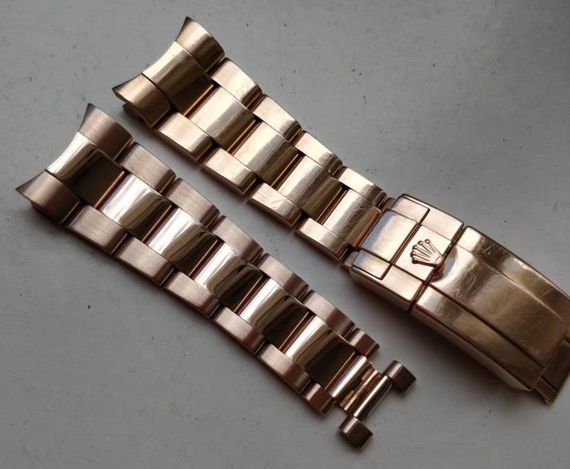 Polished and unpolished/worn halves of an Everose gold Daytona bracelet.