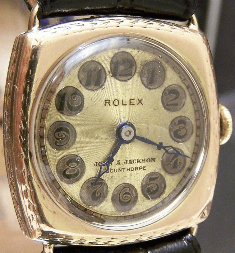 1920's Rolex with concentric guilloche telephone dial co-branded by an English retailer.