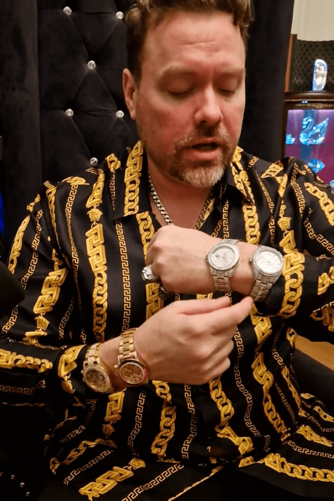 Richard Heart wearing 4 of his gem-set Rolexes.