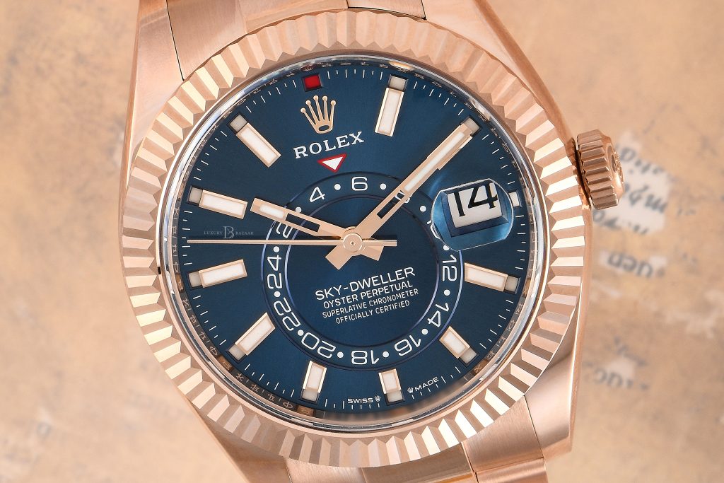 Rolex Sky-Dweller Ref. 336935 with a blue-green dial.