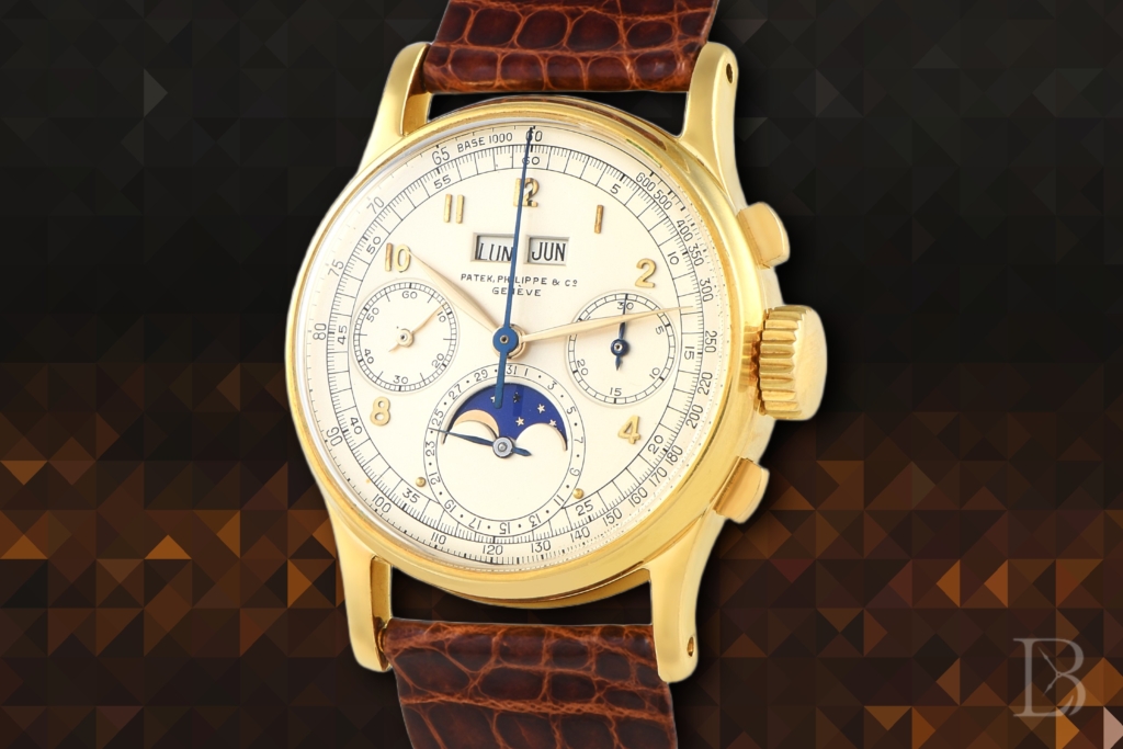 Yellow gold perpetual calendar chronograph watch on leather strap