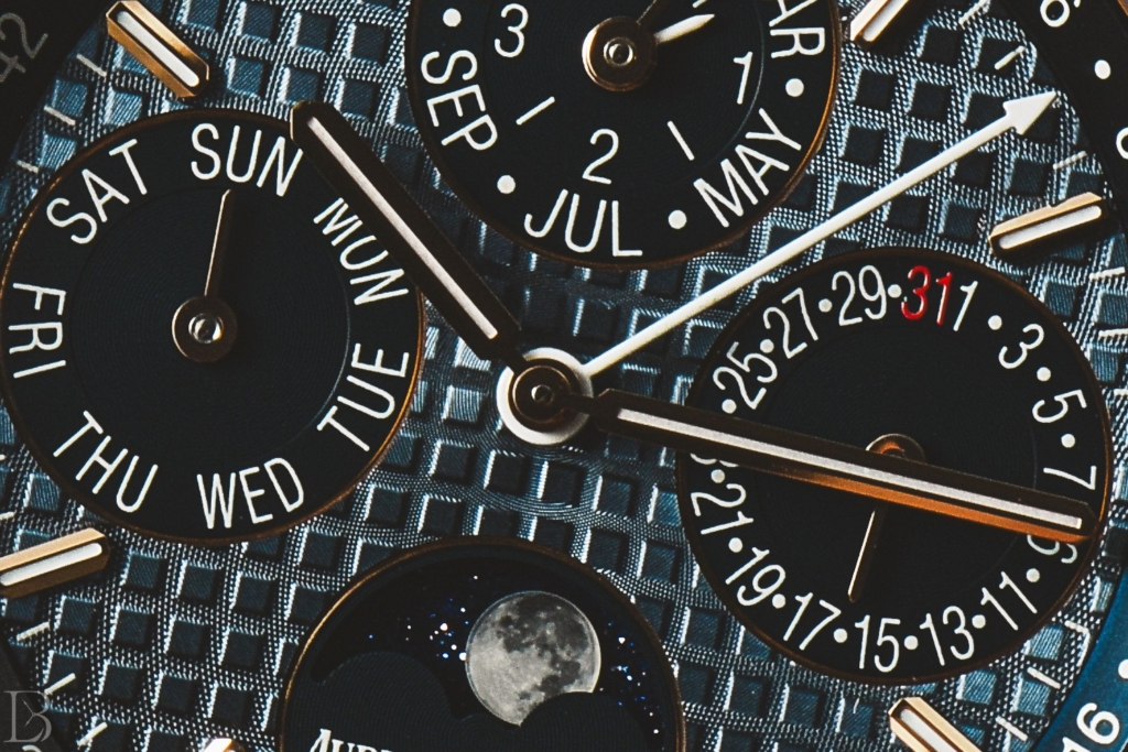 The grande tapisserie dial texture is a hallmark of the Audemars Piguet Royal Oak line.