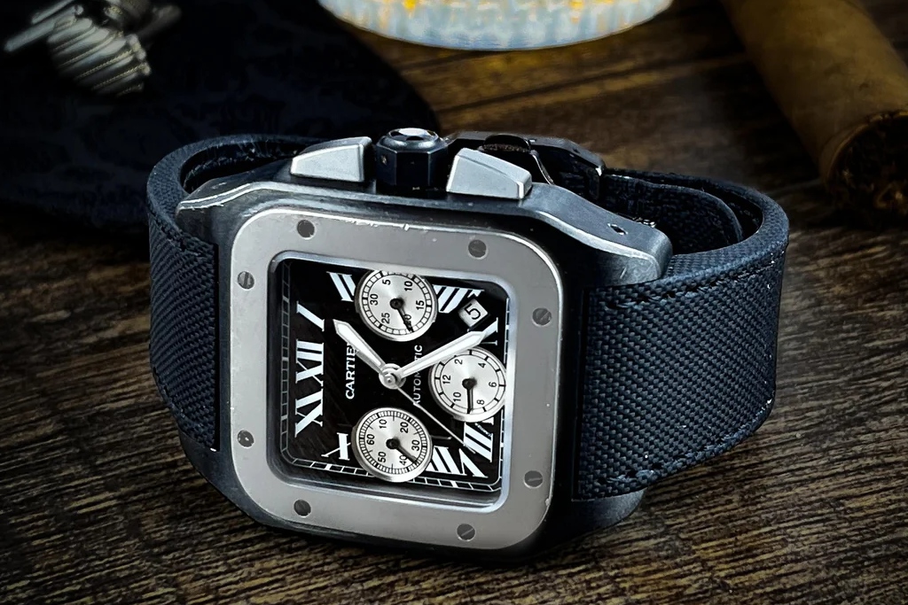 Ref. W2020005 has a black PVD-coated stainless steel case with a titanium bezel