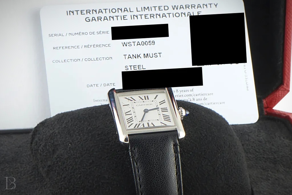 Cartier reference numbers are clearly listed on the warranty card for the watch