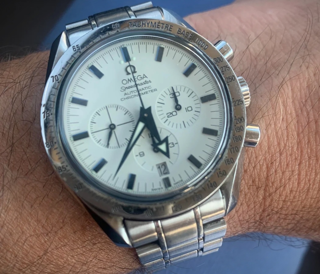 42mm automatic Omega Speedmaster Broad Arrow with white dial and blued hands
