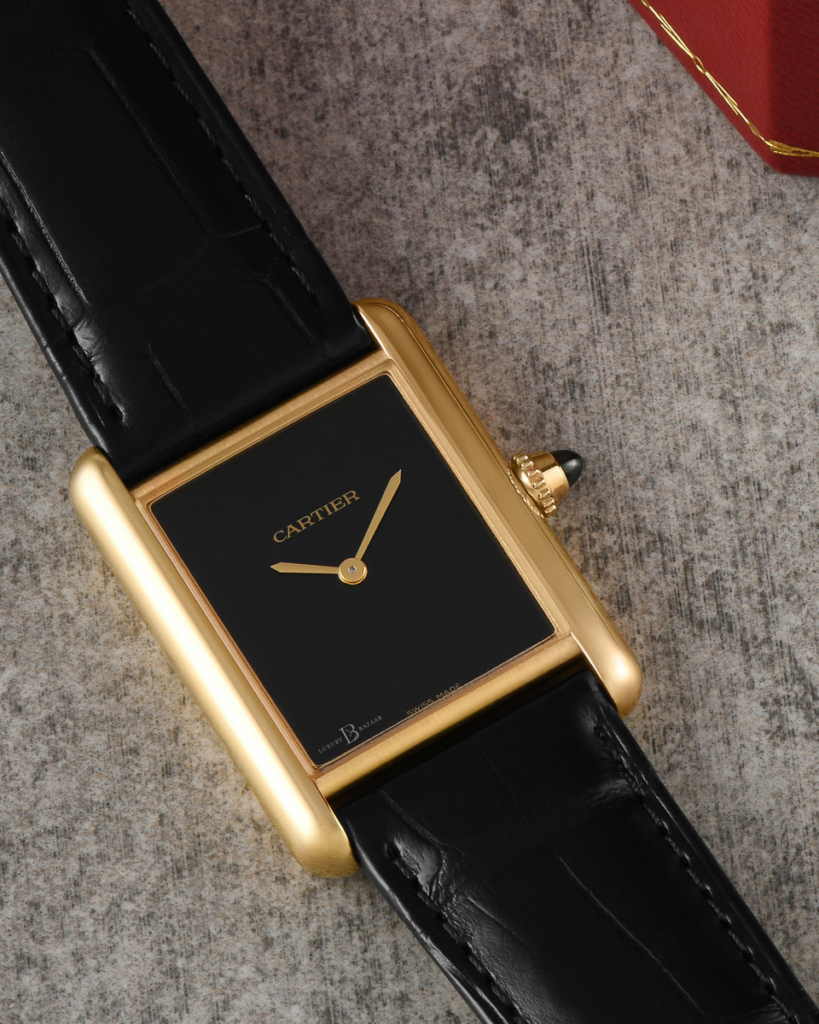 Cartier Tank, yellow gold, black dial