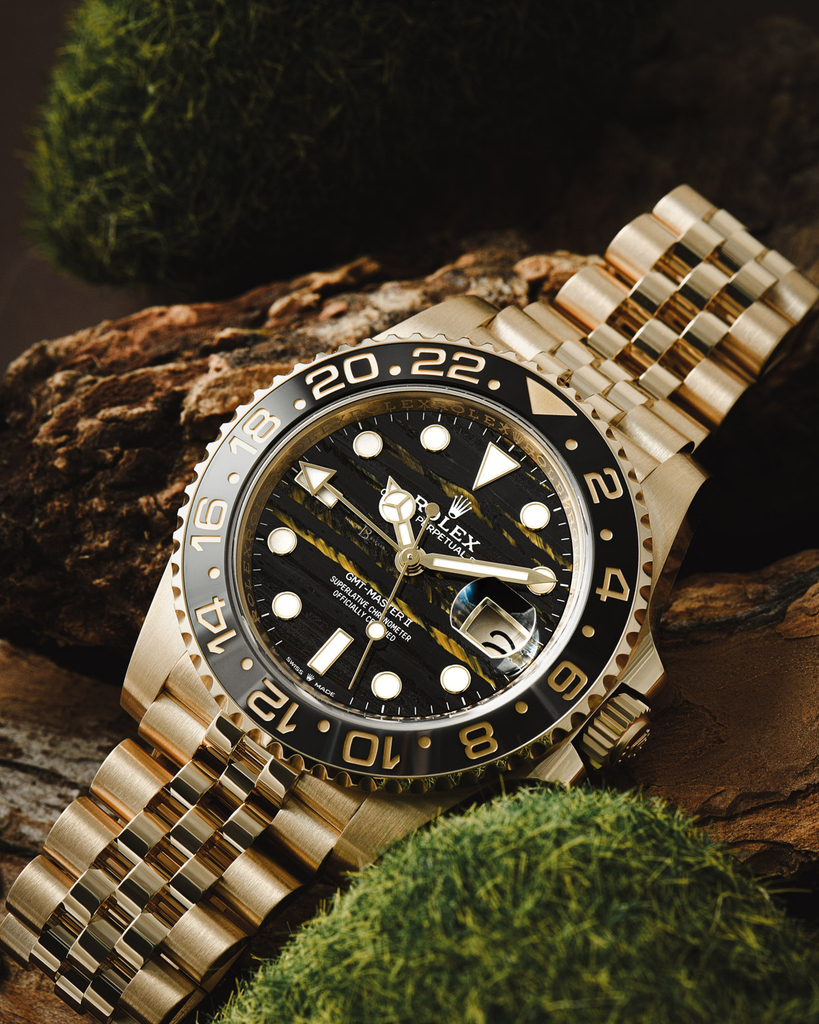 Rolex GMT-Master II ref. 126718GRNR in yellow gold with a tiger iron dial.
