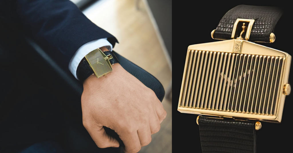 The Corum Rolls-Royce features an 18k gold case modeled after the car’s vertical radiator grille, crowned by the Spirit of Ecstasy emblem.